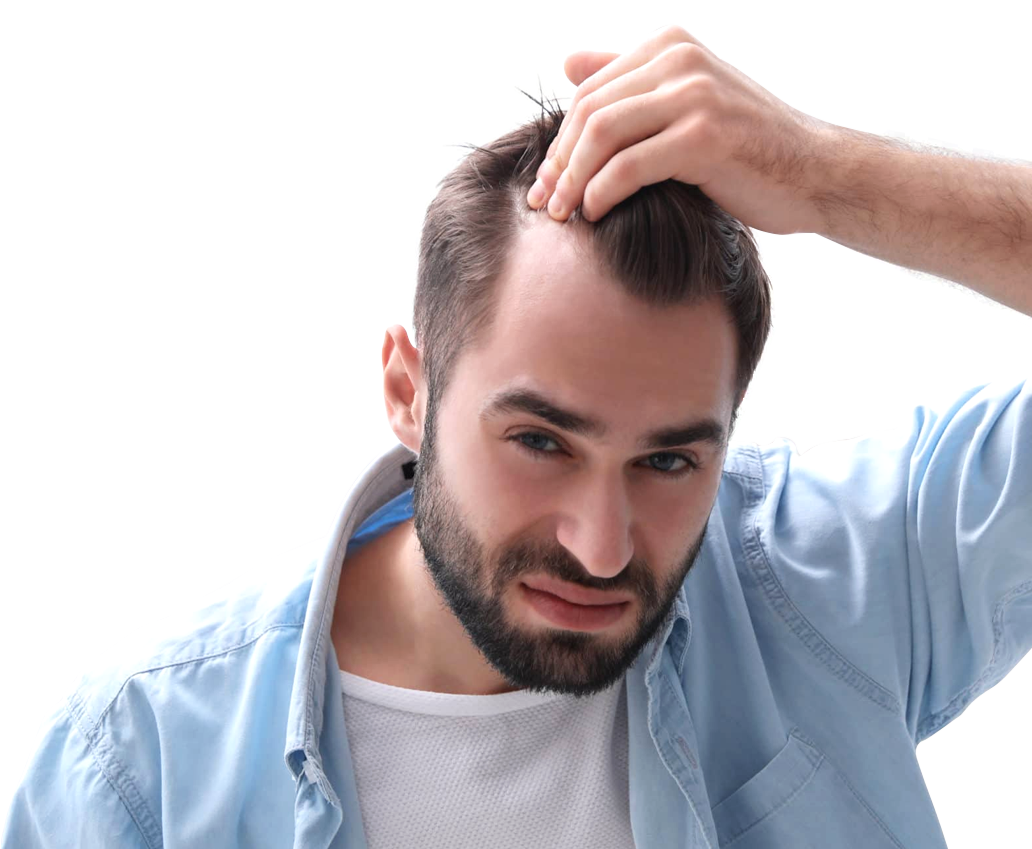 A man running his left hand through his hair and examining his receding hairline unhappily